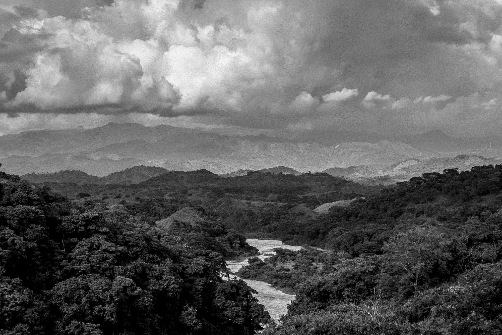 A view of the Lempa River from Piedras Coloradas, the area where thousands of refugees crossed through on Mar. 18, 1981, fleeing war and a barrage of bullets and mortars launched by the Salvadoran Air Force. On the left bank of the river is Honduras.